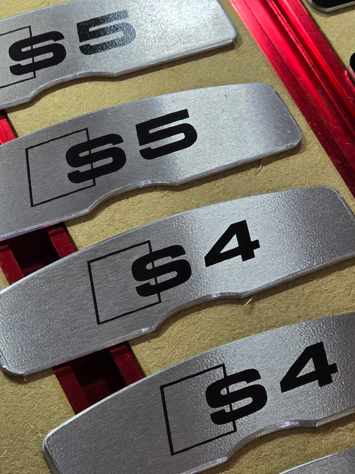 Brushed aluminum S4 and S5 brake face plates close-up