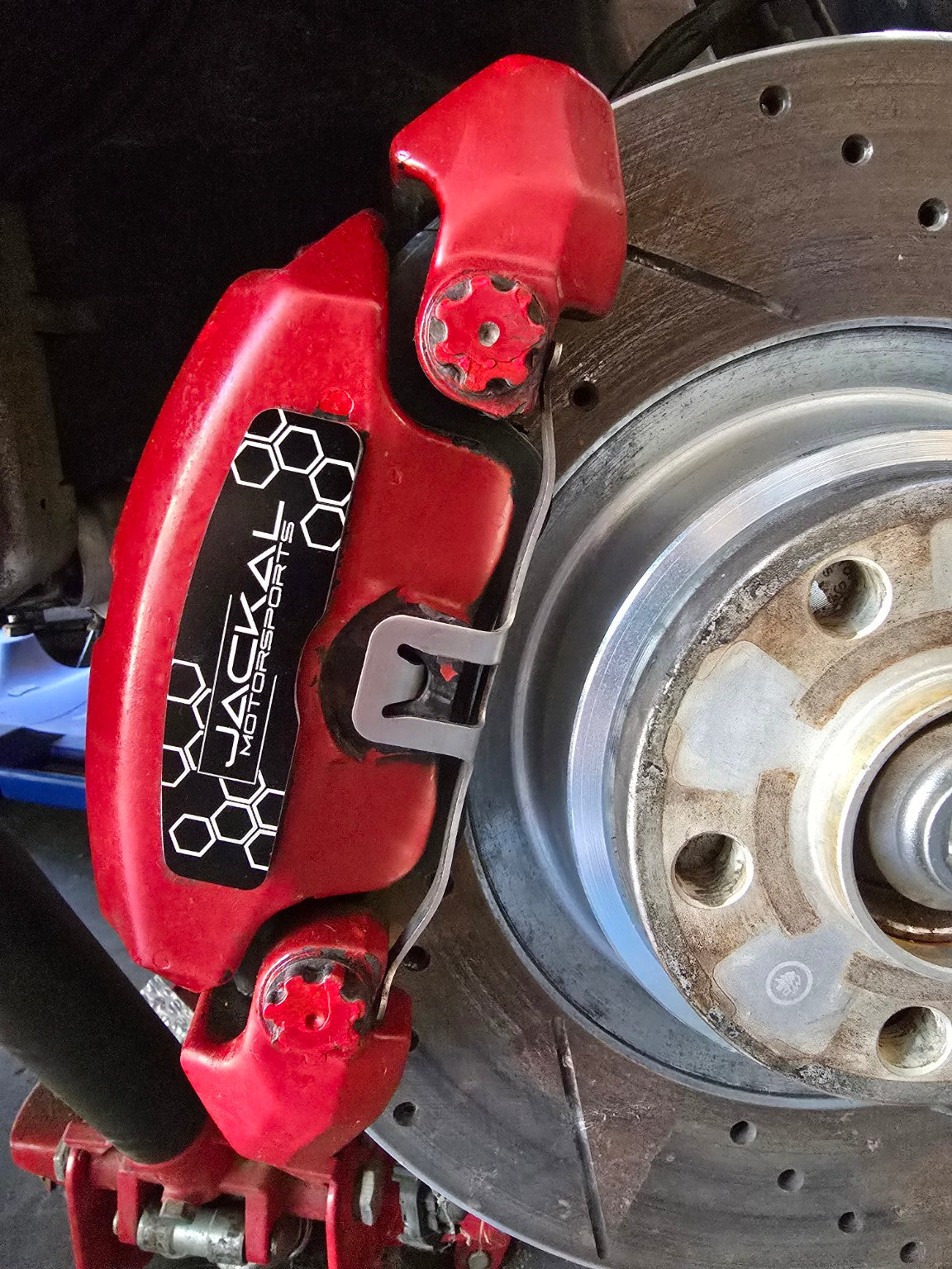 Black Jackal Motorsports brake face plate installed on Audi caliper