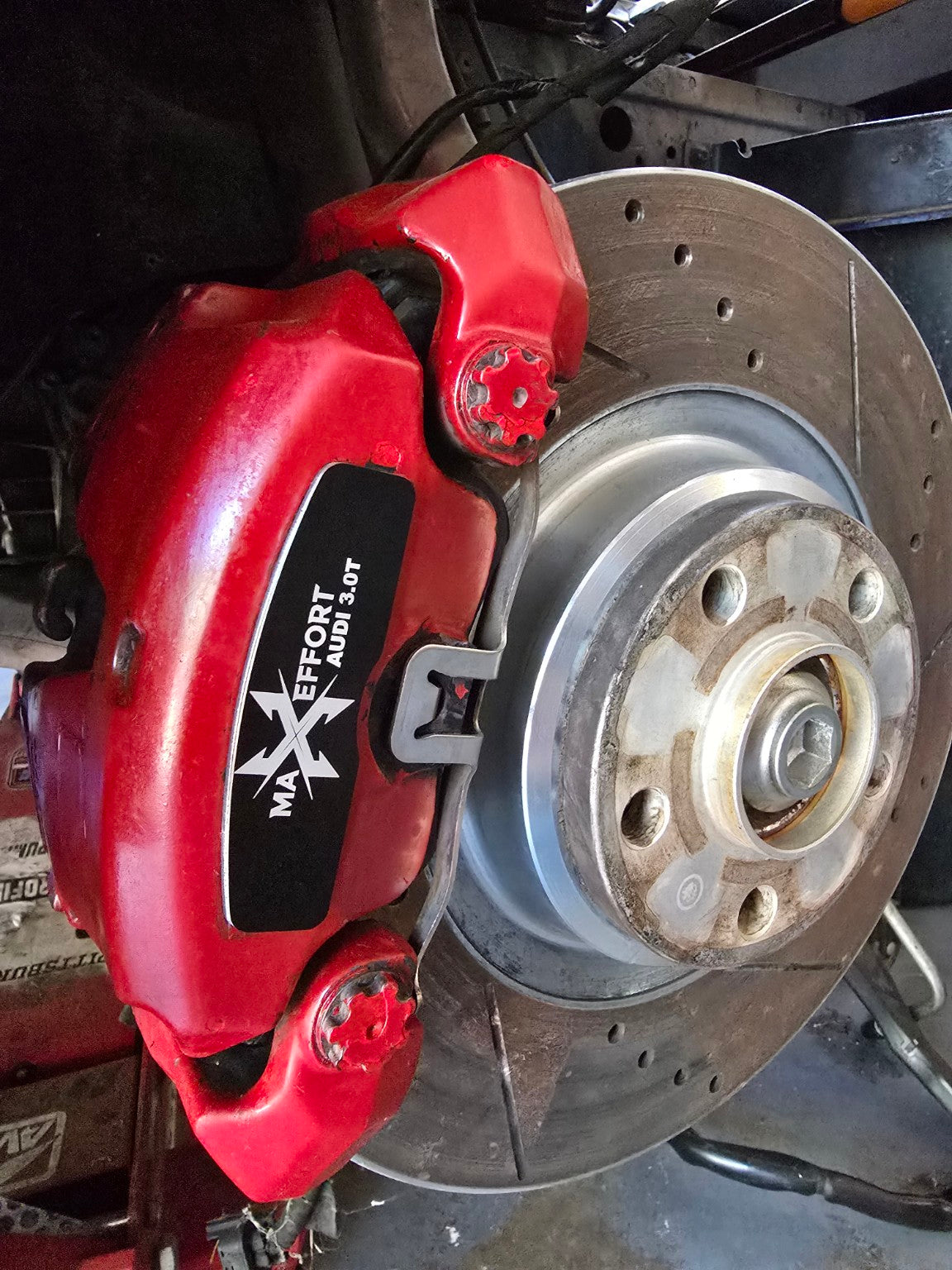 Black Max Effort Audi 3.0T brake face plate installed on Audi caliper