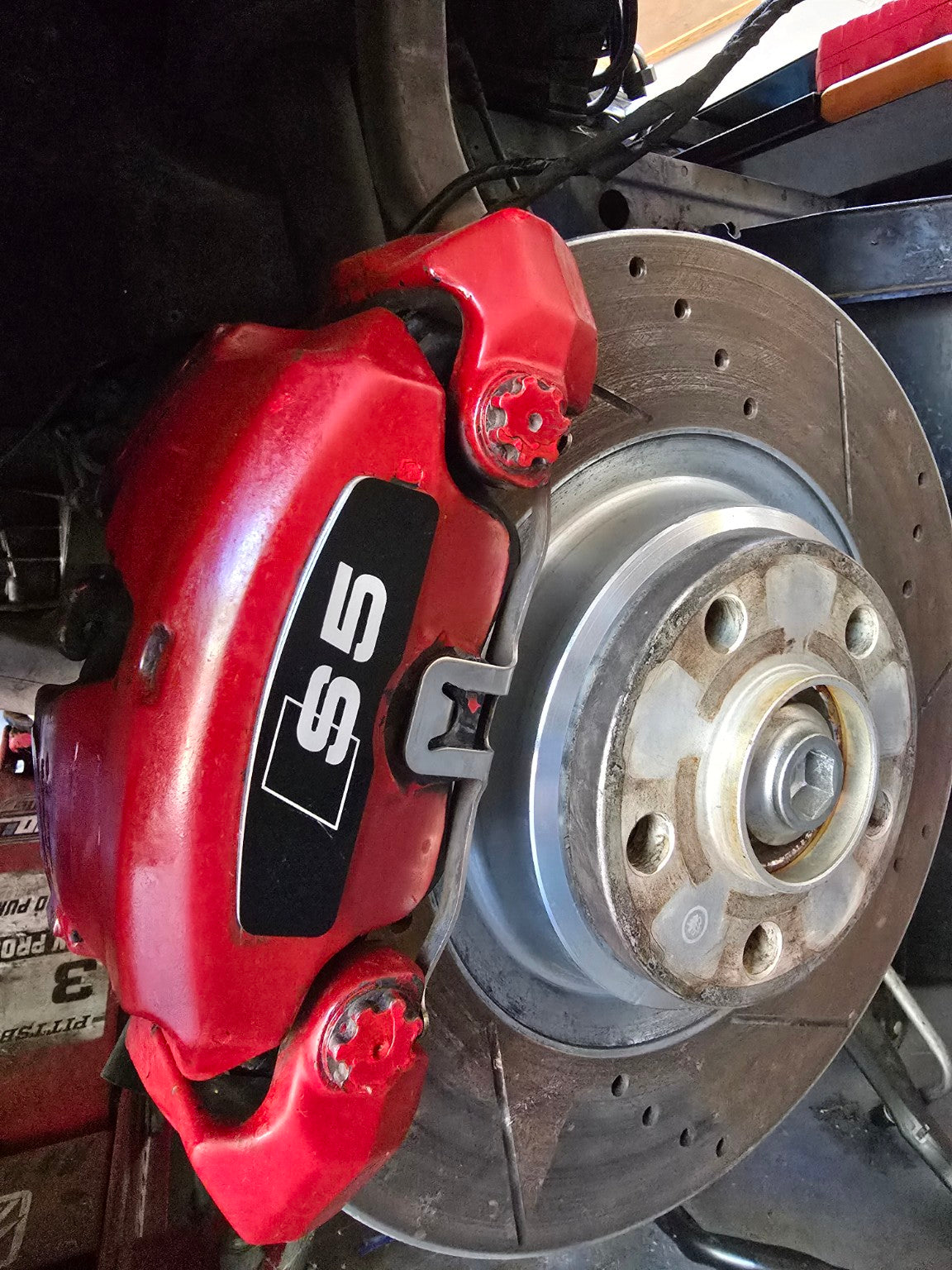 Black S5 brake face plate installed on Audi caliper